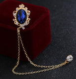 Celebrity brooch stunning gold plated vintage look blue or black stone pin ggg66