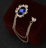 Celebrity brooch stunning gold plated vintage look blue or black stone pin ggg66