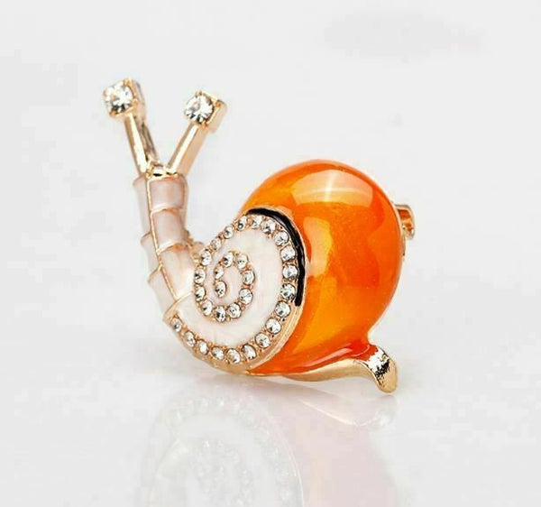 Stunning diamante gold plated orange snail brooch suit coat broach pin collar u