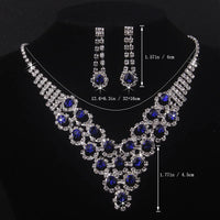 High end and elegant bridal accessories, including a necklace and a pair of earrings, set in blue, red, and purple. Bridal acces