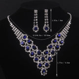 High end and elegant bridal accessories, including a necklace and a pair of earrings, set in blue, red, and purple. Bridal acces