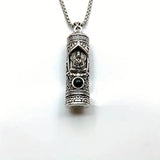 A rotating pendant of the Buddha Amitabha with scripture, a vintage and aged projection of Buddha statues, a trendy necklace of