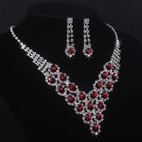 High end and elegant bridal accessories, including a necklace and a pair of earrings, set in blue, red, and purple. Bridal acces