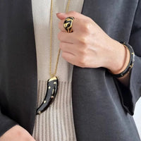 Double-sided horn pendant necklace