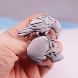 Crow skull brooch