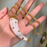 Double-sided horn pendant necklace