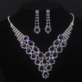 High end and elegant bridal accessories, including a necklace and a pair of earrings, set in blue, red, and purple. Bridal acces