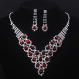 High end and elegant bridal accessories, including a necklace and a pair of earrings, set in blue, red, and purple. Bridal acces