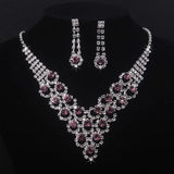High end and elegant bridal accessories, including a necklace and a pair of earrings, set in blue, red, and purple. Bridal acces